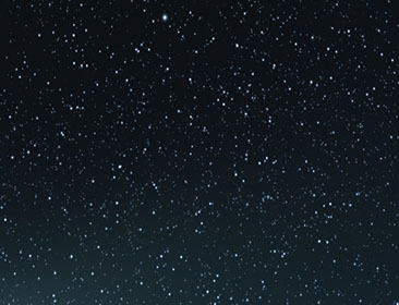 A starry night background for the faded "Philosophy For Us All "neon sign.
